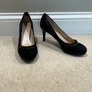 Black heels that are a velvety/suede material